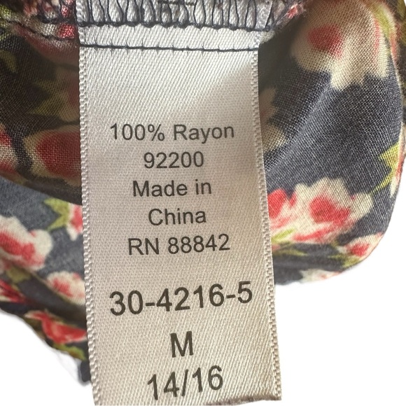 Woman Within Floral Blouse - Picture 7 of 7